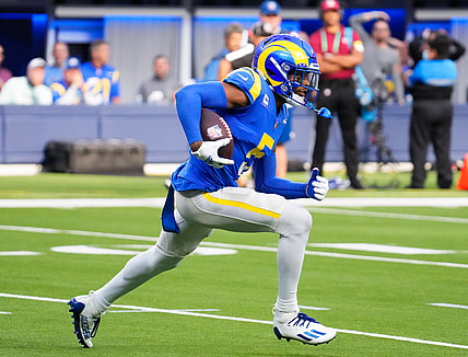 Oct 24, 2021; Inglewood, California, USA; Los Angeles Rams cornerback Jalen Ramsey (5) runs back an interception in the fourth quarter against the Detroit Lions  at SoFi Stadium. Mandatory Credit: Robert Hanashiro-USA TODAY Sports