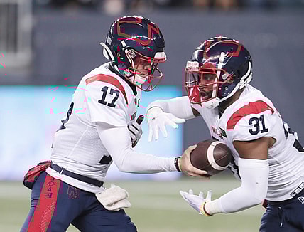 Nov 6, 2021; Winnipeg, Manitoba, CAN; Montreal Alouettes quarterback Trevor Harris (17) hands the ball off to Montreal Alouettes running back William Stanback (31) during the 2nd quarter against the Winnipeg Blue Bombers during a Canadian football League game at IG Field. Mandatory Credit: Bruce Fedyck-USA TODAY Sport