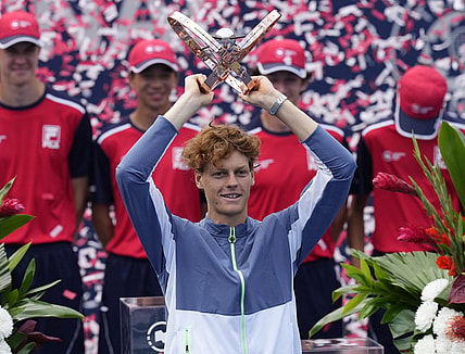 Aug 13, 2023; Toronto, Ontario, Canada; Jannik Sinner (ITA) hoists the National Bank Open trophy after defeating Alex de Minaur (not pictured) in the championship game at Sobeys Stadium. Mandatory Credit: John E. Sokolowski-USA TODAY Sports