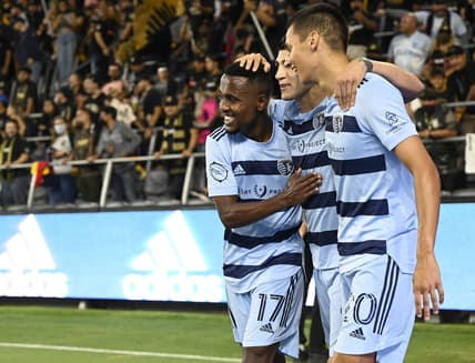 Aug 4, 2021; Los Angeles, CA, Los Angeles, CA, USA;  Sporting Kansas City midfielder Gadi Kinda (17) and forward Daniel Salloi (20) celebrate after a goal by forward Alan Pulido (9) in the first half against Los Angeles FC at Banc of California Stadium. Mandatory Credit: Jayne Kamin-Oncea-USA TODAY Sports