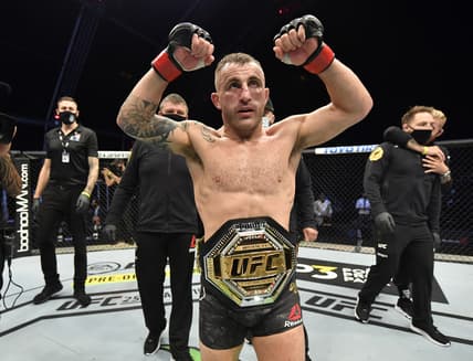 July 12, 2020; Abu Dhabi, UAE;  Alexander Volkanovski of Australia celebrates after his split-decision victory over Max Holloway in their UFC featherweight championship fight during the UFC 251 event at Flash Forum on UFC Fight Island on July 12, 2020 on Yas Island, Abu Dhabi, United Arab Emirates. Mandatory Credit: Jeff Bottari/Zuffa LLC via USA TODAY Sports