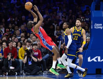 Dec 16, 2022; Philadelphia, Pennsylvania, USA; Philadelphia 76ers guard James Harden (1) is fouled while shooting against Golden State Warriors forward Jonathan Kuminga (00) and guard Klay Thompson (11) during the first quarter at Wells Fargo Center. Mandatory Credit: Bill Streicher-USA TODAY Sports