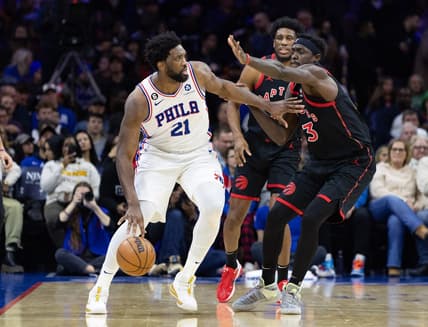 Dec 19, 2022; Philadelphia, Pennsylvania, USA; Philadelphia 76ers center Joel Embiid (21) dribbles the ball against Toronto Raptors forward Pascal Siakam (43) during the second quarter at Wells Fargo Center. Mandatory Credit: Bill Streicher-USA TODAY Sports