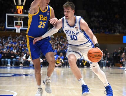 Jan 20, 2024; Durham, North Carolina, USA; Duke Blue Devils center Kyle Filipowski (30) drives to the basket as Pittsburgh Panthers forward Guillermo Diaz Graham (25) defends during the second half at Cameron Indoor Stadium.  The Panthers won 80-76. Mandatory Credit: Rob Kinnan-USA TODAY Sports
