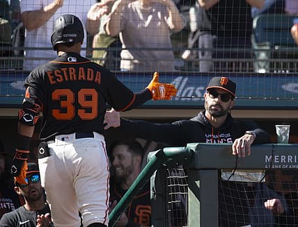 Jun 25, 2022; San Francisco, California, USA; San Francisco Giants manager Gabe Kapler (right) greets Thairo Estrada (39) after he hit a solo home run against the Cincinnati Reds during the second inning at Oracle Park. Mandatory Credit: D. Ross Cameron-USA TODAY Sports