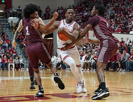 Nov 23, 2022; Bloomington, Indiana, USA;  Indiana Hoosiers guard Xavier Johnson (0) is fouled by Little Rock Trojans forward DeAntoni Gordon (1) during the first half at Simon Skjodt Assembly Hall. Mandatory Credit: Robert Goddin-USA TODAY Sports