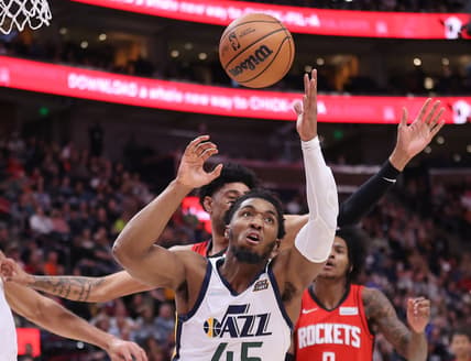 Feb 14, 2022; Salt Lake City, Utah, USA; Utah Jazz guard Donovan Mitchell (45) rebounds a missed shot in the first quarter against the Houston Rockets at Vivint Arena. Mandatory Credit: Rob Gray-USA TODAY Sports