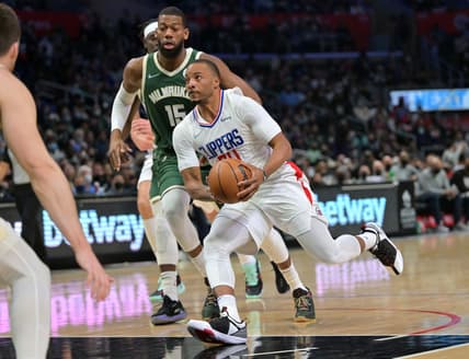 Feb 6, 2022; Los Angeles, California, USA;  Los Angeles Clippers forward Norman Powell (24) drives to the basket past Milwaukee Bucks guard Jeff Dowtin (15) in the second half at Crypto.com Arena. Mandatory Credit: Jayne Kamin-Oncea-USA TODAY Sports