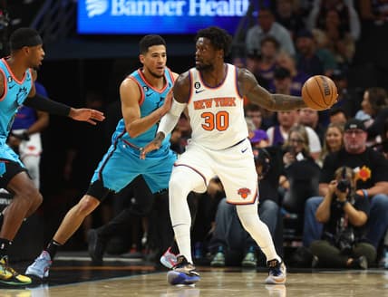 Nov 20, 2022; Phoenix, Arizona, USA; Phoenix Suns guard Devin Booker (1) defends against New York Knicks forward Julius Randle (30) in the first half at Footprint Center. Mandatory Credit: Mark J. Rebilas-USA TODAY Sports
