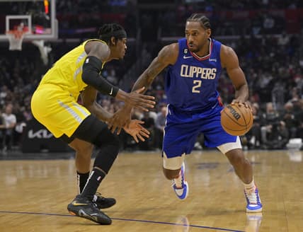 Nov 21, 2022; Los Angeles, California, USA;  Los Angeles Clippers forward Kawhi Leonard (2) is defended by Utah Jazz forward Jarred Vanderbilt (8) in the first half at Crypto.com Arena. Mandatory Credit: Jayne Kamin-Oncea-USA TODAY Sports
