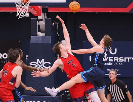 Feb 18, 2023; Moraga, California, USA; BYU Cougars guard Dallin Hall (30) shoots the ball against St. Mary's Gaels center Mitchell Saxen (11) during the first half at University Credit Union Pavilion. Mandatory Credit: Kelley L Cox-USA TODAY Sports
