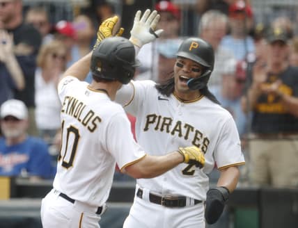 Jul 30, 2023; Pittsburgh, Pennsylvania, USA; Pittsburgh Pirates right fielder Connor Joe (2) congratulates left fielder Bryan Reynolds (10) after Reynolds hit a two run home run against the /phil/ during the sixth inning at PNC Park. Mandatory Credit: Charles LeClaire-USA TODAY Sports