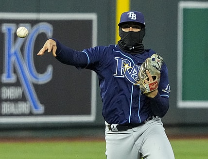 Apr 21, 2021; Kansas City, Missouri, USA; Tampa Bay Rays shortstop Willy Adames (1) throws to first base against the Kansas City Royals during the fourth inning at Kauffman Stadium. Mandatory Credit: Jay Biggerstaff-USA TODAY Sports