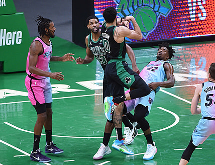 May 9, 2021; Boston, Massachusetts, USA; Boston Celtics forward Jayson Tatum (0) is called for an offensive foul on Miami Heat forward Jimmy Butler (22) during the first half at TD Garden. Mandatory Credit: Bob DeChiara-USA TODAY Sports
