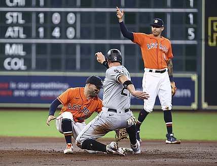 Jun 18, 2021; Houston, Texas, USA; Chicago White Sox catcher Zack Collins (21) is tagged out on a stolen base attempt by Houston Astros second baseman Jose Altuve (27) during the second inning at Minute Maid Park. Mandatory Credit: Troy Taormina-USA TODAY Sports