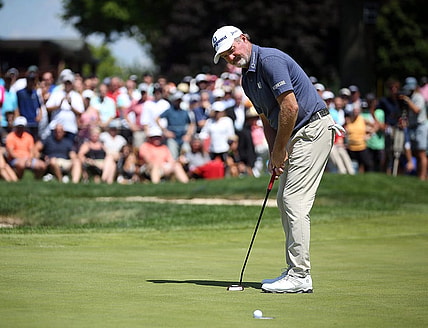 Jerry Kelly watches as his putt for par falls into the cup to win the Bridgestone Senior Players Championship at Firestone Country Club on Sunday.

Bridgestone 4