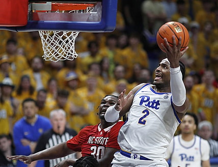 Mar 9, 2024; Pittsburgh, Pennsylvania, USA;  Pittsburgh Panthers forward Blake Hinson (2) goes to the basket past North Carolina State Wolfpack forward DJ Burns Jr. (30) during the second half at the Petersen Events Center. The Panthers won 81-73. Mandatory Credit: Charles LeClaire-USA TODAY Sports