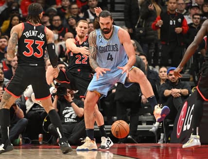 Dec 29, 2022; Toronto, Ontario, CAN;  Memphis Grizzlies center Steven Adams (4) grabs a rebound in front of Toronto Raptors guard Malachi Flynn (22) in the first half at Scotiabank Arena. Mandatory Credit: Dan Hamilton-USA TODAY Sports
