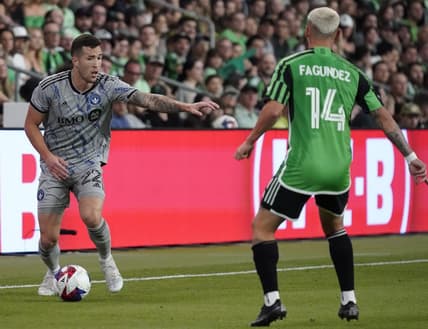 Mar 4, 2023; Austin, Texas, USA; CF Montreal defender Aaron Herrera (22) plays the ball against Austin FC forward Diego Fagundez (14) at Q2 Stadium. Mandatory Credit: Scott Wachter-USA TODAY Sports