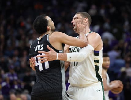Mar 13, 2023; Sacramento, California, USA; Sacramento Kings center Trey Lyles (41) confronts Milwaukee Bucks center Brook Lopez (11) during the fourth quarter at Golden 1 Center. Mandatory Credit: Kelley L Cox-USA TODAY Sports