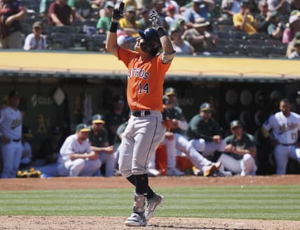 Jul 23, 2023; Oakland, California, USA; Houston Astros second baseman Mauricio Dubon (14) celebrates after hitting a solo home run against the Oakland Athletics during the ninth inning at Oakland-Alameda County Coliseum. Mandatory Credit: Kelley L Cox-USA TODAY Sports