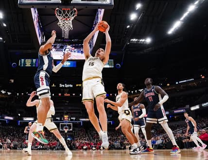 Dec 16, 2023; Indianapolis, Indiana, USA;  Purdue Boilermakers center Zach Edey (15) rebounds the ball against Arizona Wildcats forward Keshad Johnson (16) during the first half at Gainbridge Fieldhouse. Mandatory Credit: Robert Goddin-USA TODAY Sports