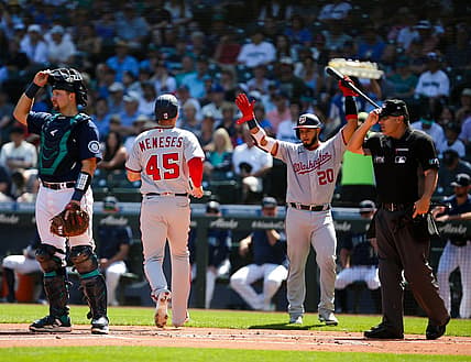 Aug 24, 2022; Seattle, Washington, USA;  Washington Nationals right fielder Joey Meneses (45) is greeted by catcher Keibert Ruiz (20) after scoring against the Seattle Mariners during the first inning at T-Mobile Park. Mandatory Credit: Lindsey Wasson-USA TODAY Sports