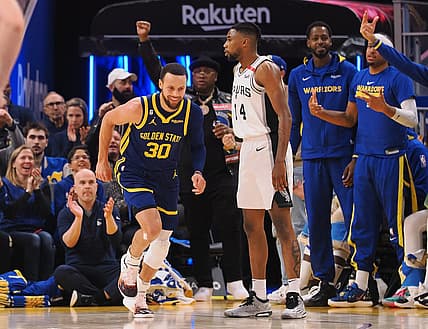 Mar 31, 2023; San Francisco, California, USA; Golden State Warriors guard Stephen Curry (30) smiles as he returns to defense after scoring a three point basket against the San Antonio Spurs during the second quarter at Chase Center. Mandatory Credit: Kelley L Cox-USA TODAY Sports