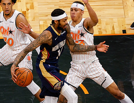 Apr 22, 2021; Orlando, Florida, USA; New Orleans Pelicans forward Brandon Ingram (14) drives the lane past Orlando Magic guard R.J. Hampton (13) in the second quarter at Amway Center. Mandatory Credit: Nathan Ray Seebeck-USA TODAY Sports