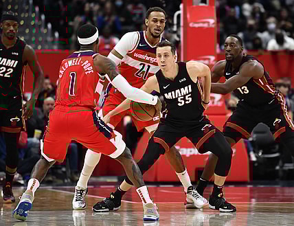 Nov 20, 2021; Washington, District of Columbia, USA; Miami Heat guard Duncan Robinson (55) defends Washington Wizards guard Kentavious Caldwell-Pope (1) during the first half at Capital One Arena. Mandatory Credit: Brad Mills-USA TODAY Sports
