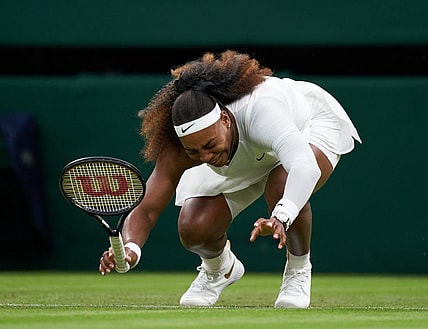 Jun 29, 2021; London, United Kingdom;  Serena Williams (USA) falls to the court while playing Aliaksandra Sasnovich (BLR) in first round ladies singles on centre court at All England Lawn Tennis and Croquet Club.  Mandatory Credit: Peter Van den Berg-USA TODAY Sports