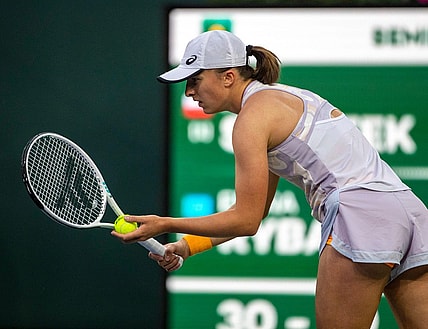 Iga Swiatek of Poland prepares a serve to Elena Rybakina of Kazakhstan during their semifinal match at the BNP Paribas Open at the Indian Wells Tennis Garden in Indian Wells, Calif., Friday, March 17, 2023.
