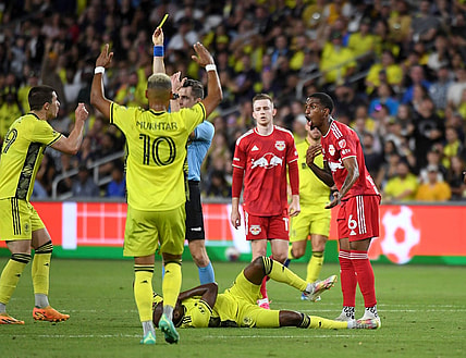 Oct 21, 2023; Nashville, Tennessee, USA; New York Red Bulls defender Kyle Duncan (6) reacts after being given a yellow card against the Nashville SC during the second half at Geodis Park. Mandatory Credit: Christopher Hanewinckel-USA TODAY Sports