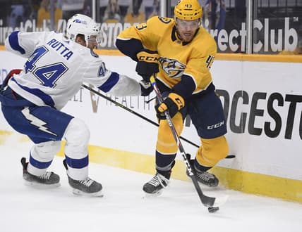 Feb 9, 2021; Nashville, Tennessee, USA;  Nashville Predators center Sean Malone (43) skates past Tampa Bay Lightning defenseman Jan Rutta (44) during the first period at Bridgestone Arena. Mandatory Credit: Steve Roberts-USA TODAY Sports