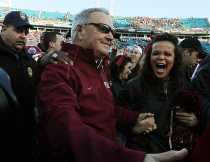 Jan. 1, 2010: A fan smiles as she congratulates FSU coach Bobby Bowden after his final game against West Virginia at Jacksonville Municipal Stadium for the Gator Bowl. [Kelly Jordan, Florida Times-Union]