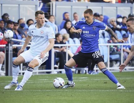 Jul 3, 2022; San Jose, California, USA; San Jose Earthquakes forward Benji Kikanovic (28) controls the ball against Chicago Fire midfielder Fabiran Herbers (21) during the first half at PayPal Park. Mandatory Credit: Kelley L Cox-USA TODAY Sports