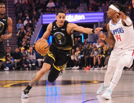 Mar 2, 2023; San Francisco, California, USA; Golden State Warriors guard Jordan Poole (3) drives in against Los Angeles Clippers shooting guard Terance Mann (14) during the first quarter at Chase Center. Mandatory Credit: Kelley L Cox-USA TODAY Sports