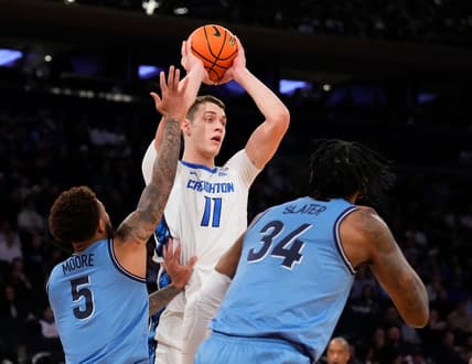 Mar 9, 2023; New York, NY, USA; Creighton Bluejays center Ryan Kalkbrenner (11) defended by Villanova Wildcats guard Justin Moore (5) and Villanova Wildcats forward Brandon Slater (34)  in the first half at Madison Square Garden. Mandatory Credit: Robert Deutsch-USA TODAY Sports