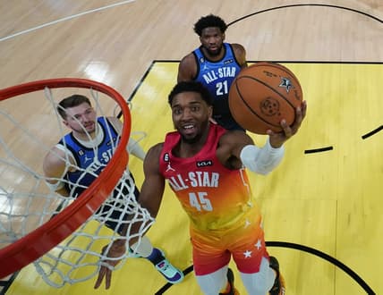 Feb 19, 2023; Salt Lake City, UT, USA; Team Giannis guard Donovan Mitchell (45) goes up for a shot against Team LeBron forward Luka Doncic (77) and center Joel Embiid (21) in the 2023 NBA All-Star Game at Vivint Arena. Mandatory Credit: Kyle Terada-USA TODAY Sports