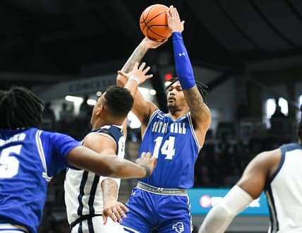 Jan 13, 2024; Indianapolis, Indiana, USA; Seton Hall Pirates guard Dre Davis (14) attempts a shot over Butler Bulldogs guard Pierre Brooks (21) during the first half at Hinkle Fieldhouse. Mandatory Credit: Robert Goddin-USA TODAY Sports