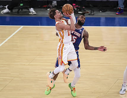 Jun 2, 2021; New York, New York, USA; Atlanta Hawks guard Trae Young (11) shoots a three point shot while be guarded by New York Knicks forward Reggie Bullock (25) in the fourth quarter during game five in the first round of the 2021 NBA Playoffs at Madison Square Garden. Mandatory Credit: Wendell Cruz-USA TODAY Sports