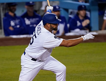 May 17, 2021; Los Angeles, California, USA;  Los Angeles Dodgers first baseman Albert Pujols (55) singles in the third inning to drive in a run against the Arizona Diamondbacks at Dodger Stadium. It was Pujols' first game as a Dodger after signing a contract earlier in the day. Mandatory Credit: Robert Hanashiro-USA TODAY Sports