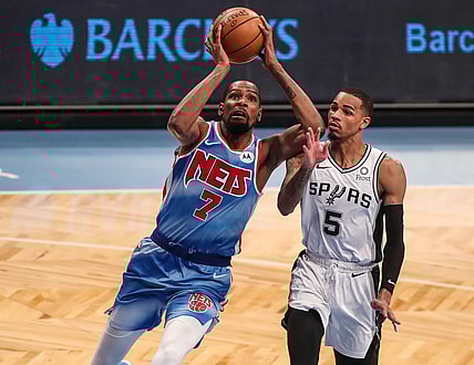 May 12, 2021; Brooklyn, New York, USA; Brooklyn Nets forward Kevin Durant (7) and San Antonio Spurs guard Dejounte Murray (5) at Barclays Center. Mandatory Credit: Wendell Cruz-USA TODAY Sports