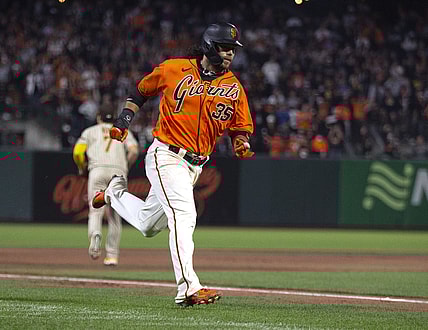 Oct 1, 2021; San Francisco, California, USA; San Francisco Giants shortstop Brandon Crawford (35) heads home on an RBI single by Mike Yastrzemski during the first inning against the San Diego Padres at Oracle Park. Mandatory Credit: D. Ross Cameron-USA TODAY Sports