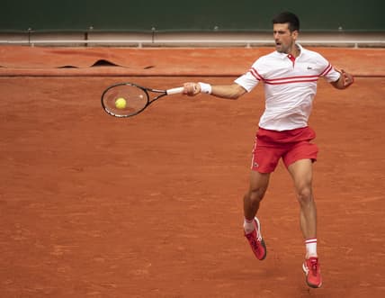 Jun 7, 2021; Paris, France; Novak Djokovic (SRB) in action during his match against Lorenzo Musetti (ITA) on day nine of the French Open at Stade Roland Garros. Mandatory Credit: Susan Mullane-USA TODAY Sports
