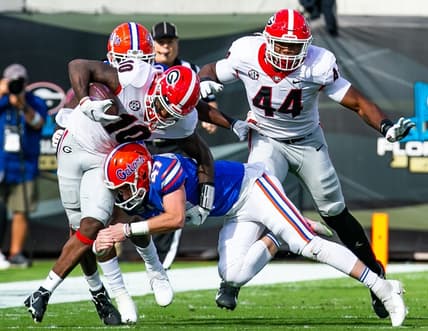 Florida Gators place kicker Jace Christmann (47) makes a touchdown saving tackles on Georgia Bulldogs wide receiver Kearis Jackson (10). The Florida Gators played the Georgia Bulldogs in the first half Saturday afternoon, October 30, 2021 at TIAA Bank Field in Jacksonville, FL. [Doug Engle/Gainesville Sun]2021

Flgai 103021 Bulldogsvsgators