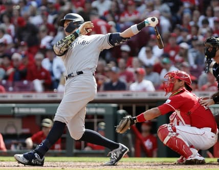 May 20, 2023; Cincinnati, Ohio, USA; New York Yankees center fielder Aaron Judge (99) hits an RBI single against the Cincinnati Reds during the third inning at Great American Ball Park. Mandatory Credit: David Kohl-USA TODAY Sports