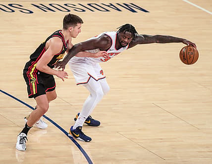 Apr 21, 2021; New York, New York, USA;  New York Knicks forward Julius Randle (30) and Atlanta Hawks guard Bogdan Bogdanovic (13) at Madison Square Garden. Mandatory Credit: Wendell Cruz-USA TODAY Sports
