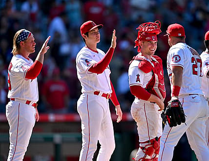 Jun 26, 2022; Anaheim, California, USA;  Los Angeles Angels first baseman David MacKinnon (39) designated hitter Shohei Ohtani (17) and catcher Max Stassi (33) high five center fielder Mike Trout (27) after the final out of the ninth inning defeating the Seattle Mariners at Angel Stadium. Mandatory Credit: Jayne Kamin-Oncea-USA TODAY Sports