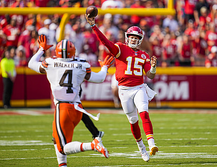 Sep 12, 2021; Kansas City, Missouri, USA; Kansas City Chiefs quarterback Patrick Mahomes (15) throws a pass as Cleveland Browns middle linebacker Anthony Walker (4) defends during the first half at GEHA Field at Arrowhead Stadium. Mandatory Credit: Jay Biggerstaff-USA TODAY Sports